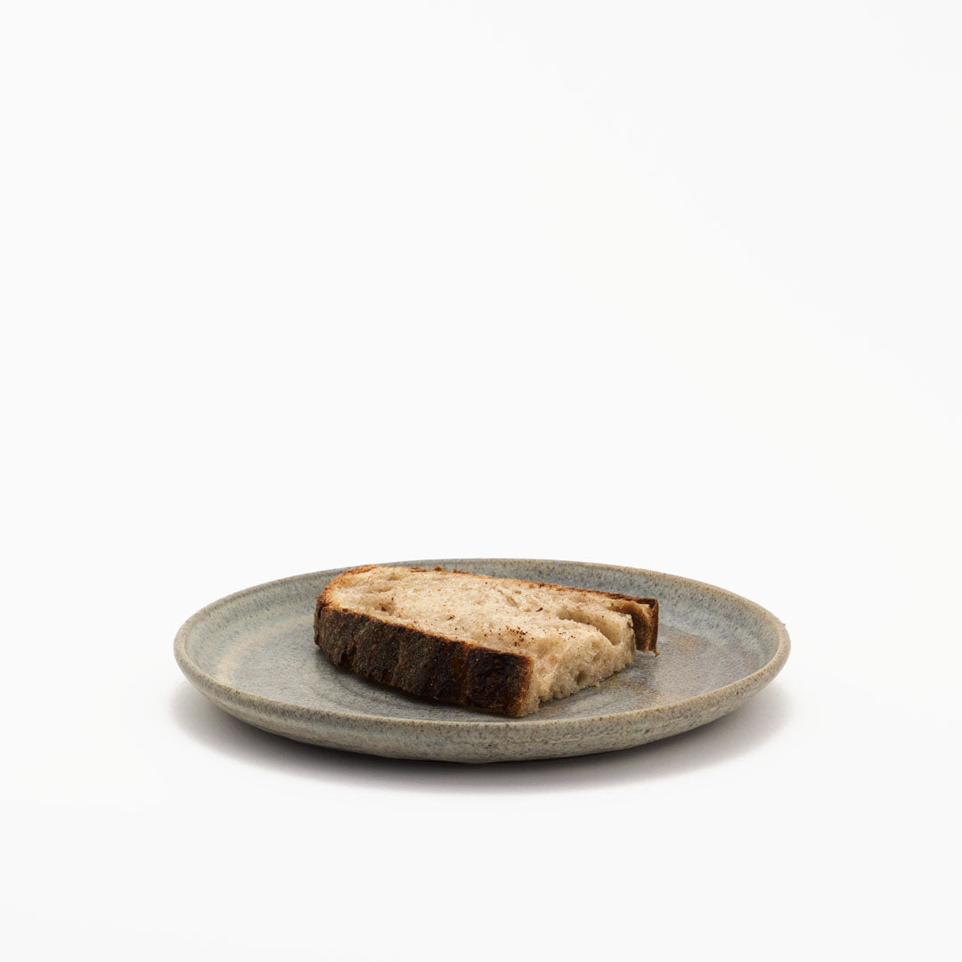 Hover image of a Ballehage collection breakfast plate, together with a piece of toast.