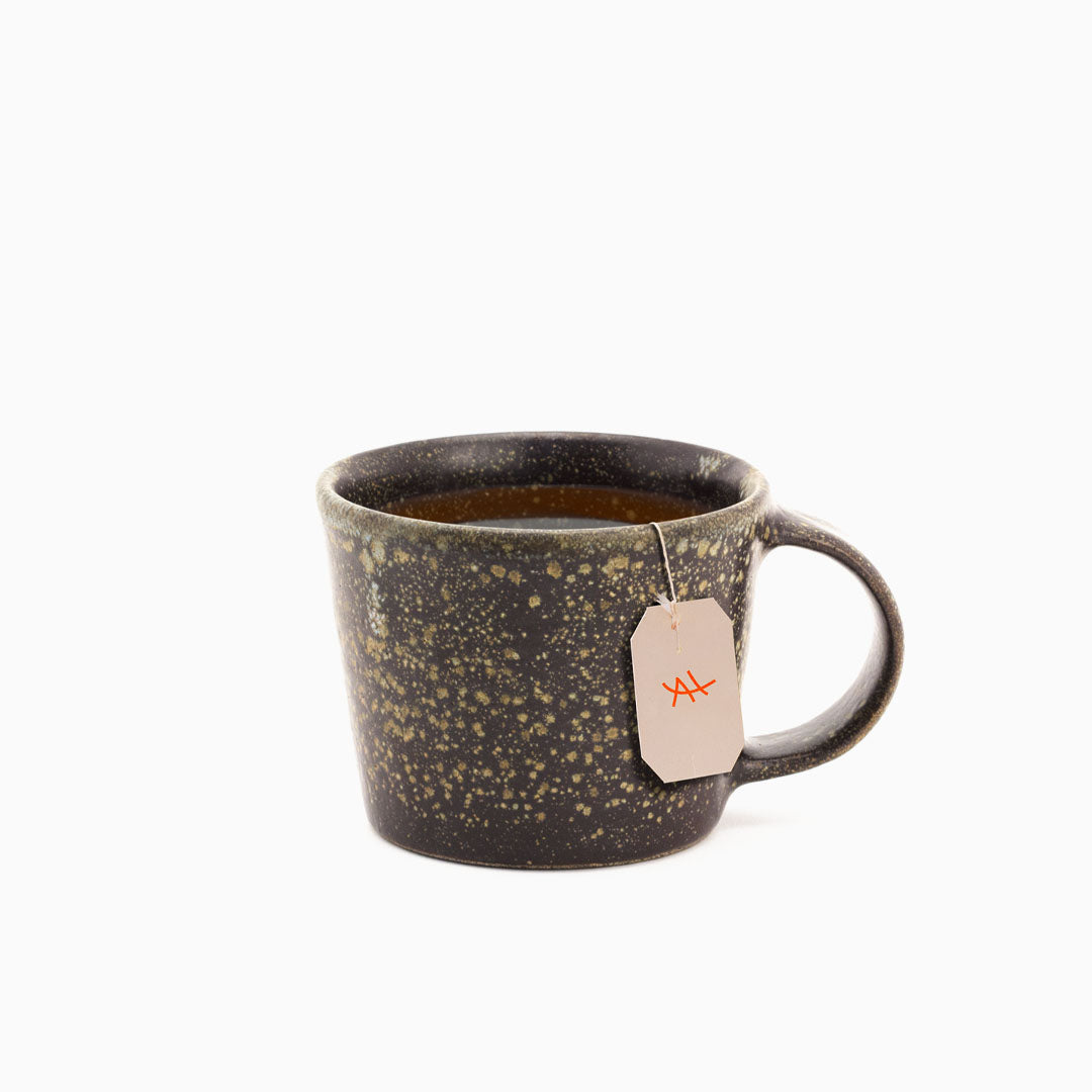 Hover image of a Vulkan collection cup filled with tea.