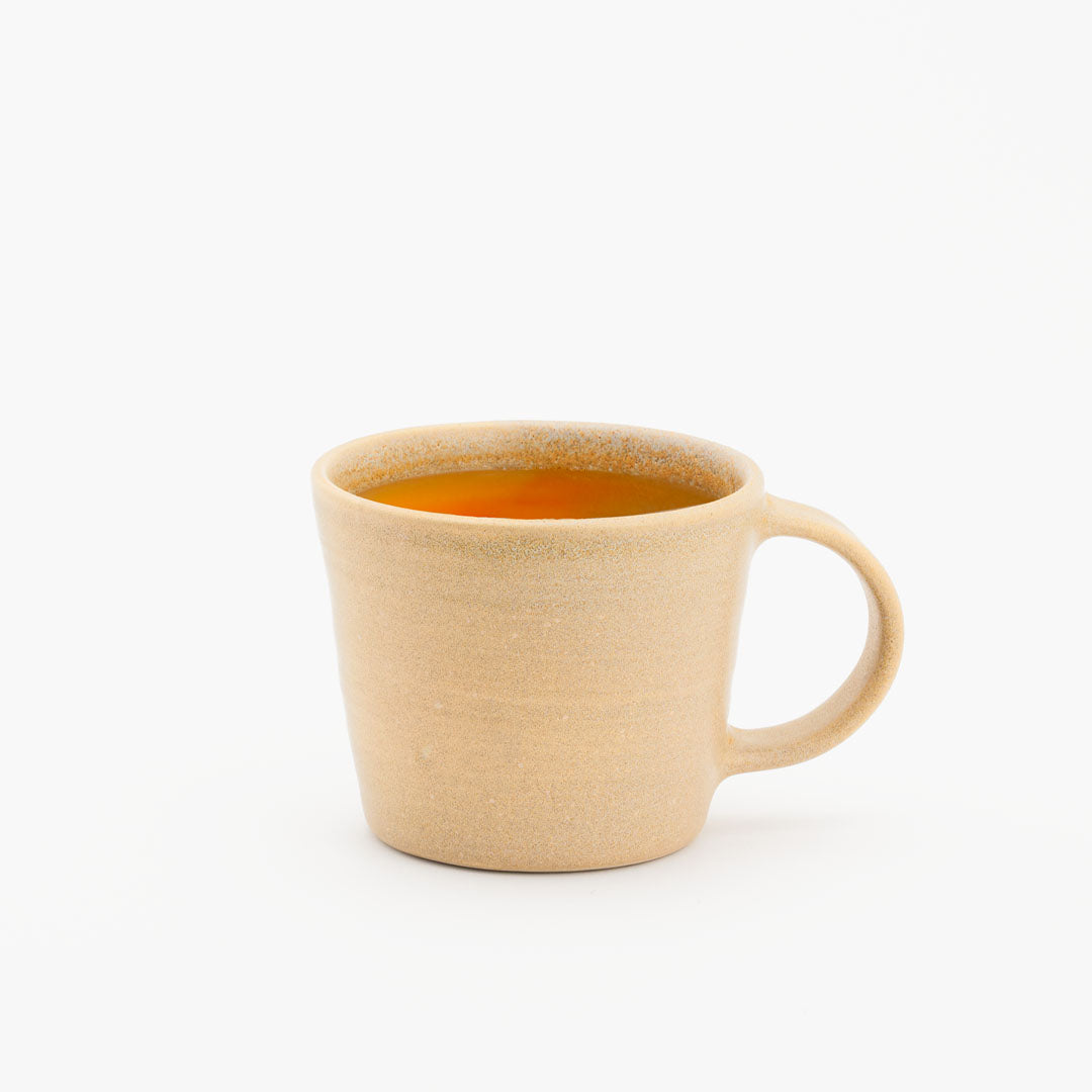 Hover image of a Peach collection cup with juice inside.