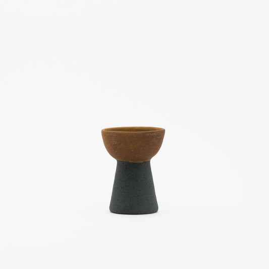 An image of a black and brown onion vase.