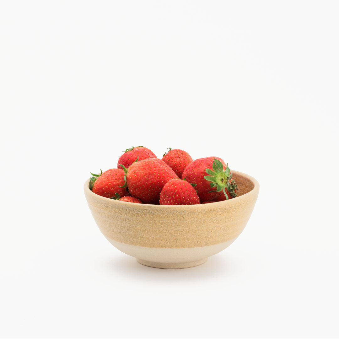 Hover image of a Peach collection breakfast bowl, filled with strawberries.