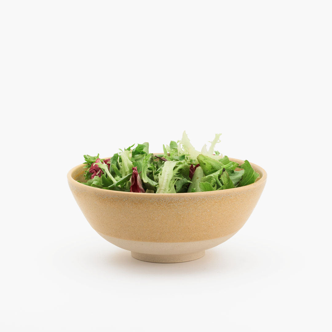 Hover image of a Peach collection lunch bowl, filled with salad mix.
