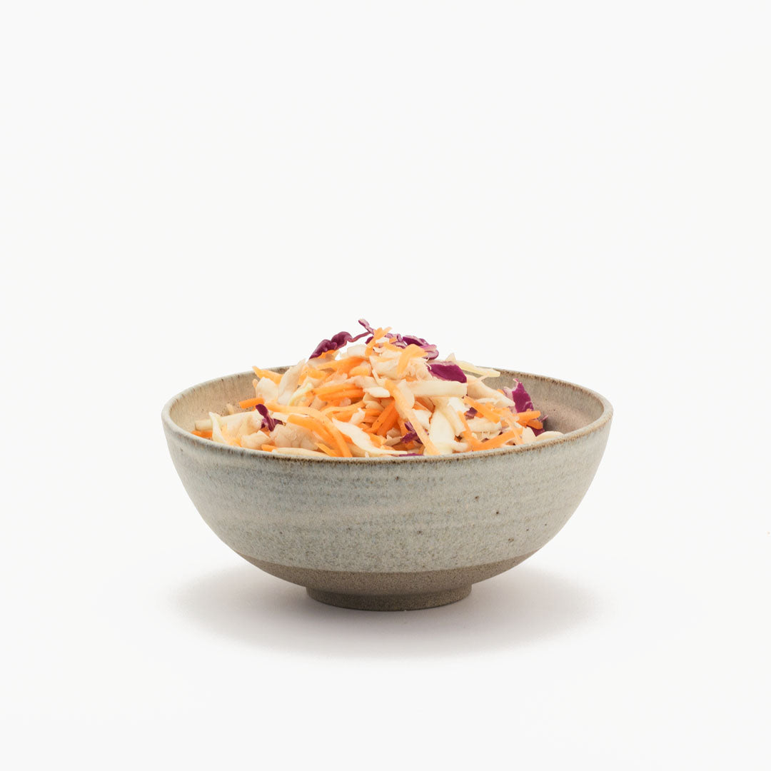 Hover image of a Ballehage collection lunch bowl filled with salad mix.